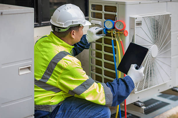 Professional Heat Pump Repair technician working in Garden City, SC